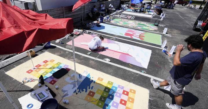 Parking spots used as colorful protest against Florida crackdown on rainbow crosswalks