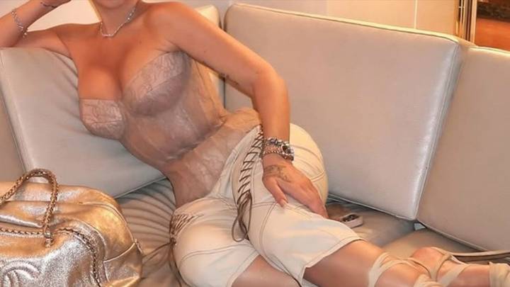 Guess The Sexy Singer Tied Up In This Corset!