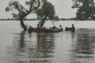 Rescuers in Pakistan scramble to save residents as swollen rivers reach dangerous levels