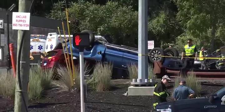 Crash at Dunkin’ parking lot in Rocky Hill leaves vehicle flipped on another