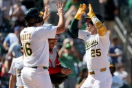 Deadspin | Four homers help Athletics complete sweep of Reds