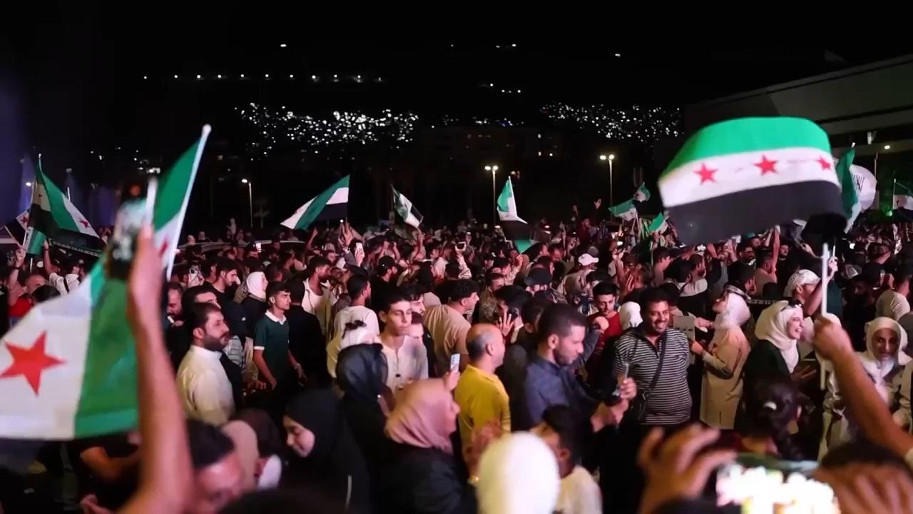 Hundreds gather in squares across Syria to watch president's speech at the UN