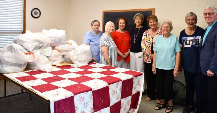 Donation tacks together Dorcas Quilters, Poshard Foundation
