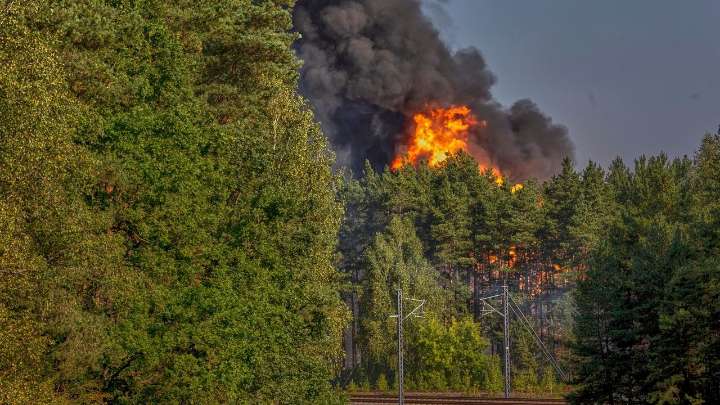 Explosions heard in Lithuania's capital after railcars loaded with liquefied gas catch fire