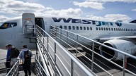 WestJet flight attendants seek to address alleged unpaid work in new agreement