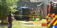 Stolen landscaping vehicle, trailer crashes into Midtown Omaha home after police chase