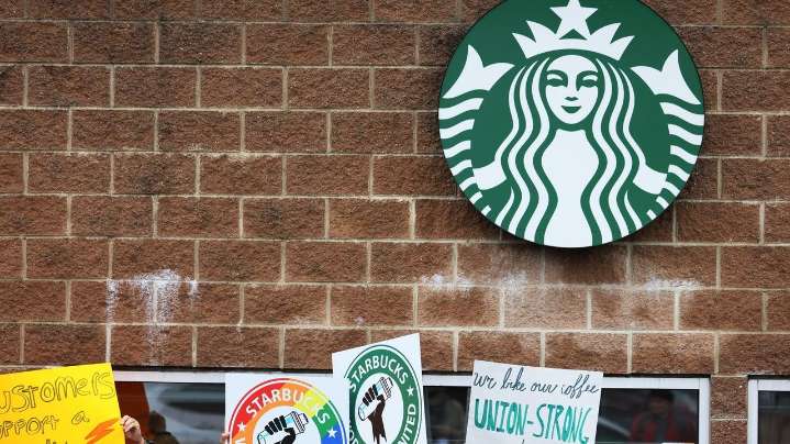 Starbucks to close stores and cut 900 workers, CEO says