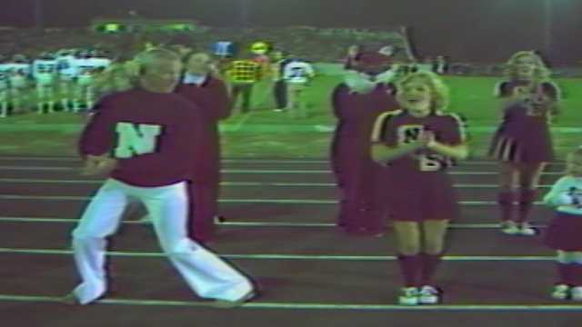 Talk show host Johnny Carson joins his alma mater's cheer squad at 1981 football game
