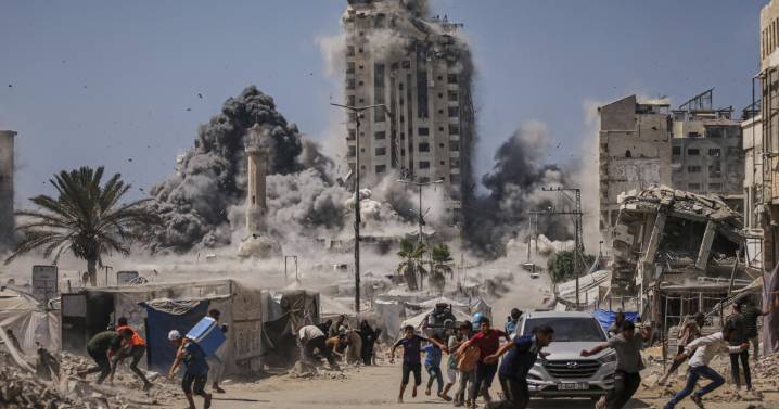 Israel strikes high-rise building and threatens to hit more in Gaza offensive