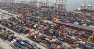 Shipping companies support a first-ever global fee on greenhouse gases, opposed by Trump officials