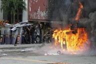 Dozens arrested and hurt in clashes with police near Philippine presidential palace