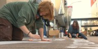 Students advocate for the environment through chalk art in downtown Duluth