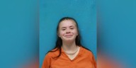 Woman accused of holding victims at gunpoint in home