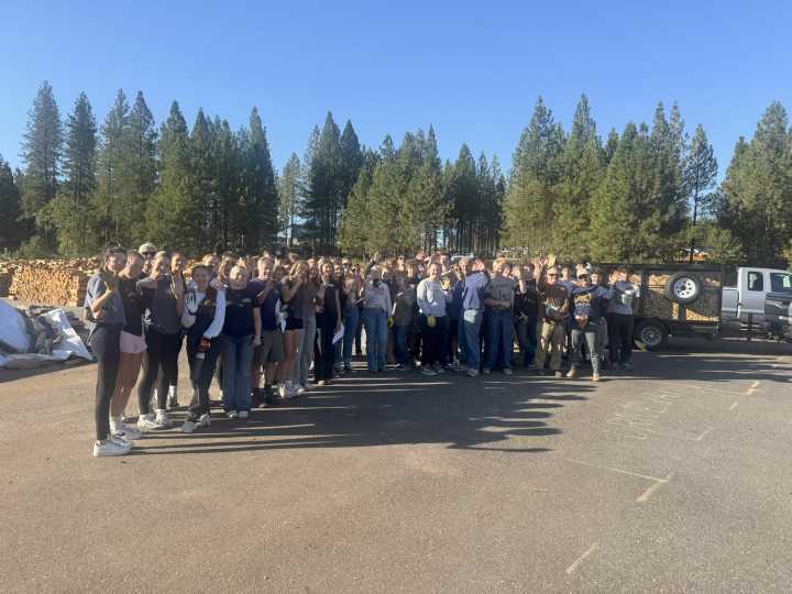 NU students and coaches help Gold Country Senior Firewood delivery