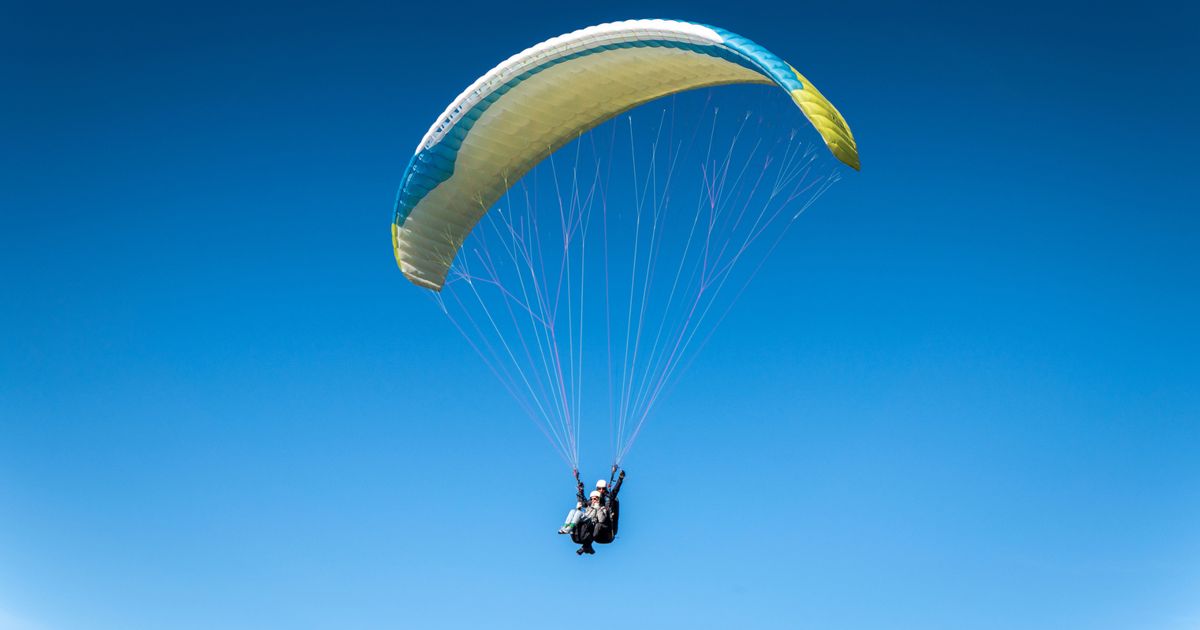Paraglider almost dies after spotting something strange 'drifting' across the sky