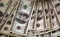 El dólar cae a la espera de las decisiones de los bancos centrales