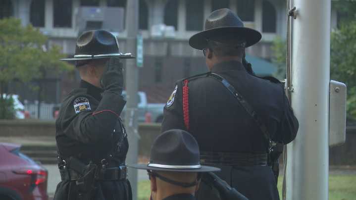 LMPD celebrates new downtown HQ with flag raising ceremony