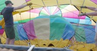 Pilots prepare to fly hot air balloons in the Great Forest Park Balloon Race