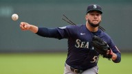Mariners' rare challenge helps secure 2-0 win over Royals, tie Astros for first place in AL West
