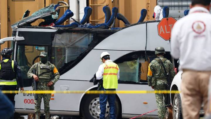 Freight train slams into a bus outside Mexico City and kills at least 10 people