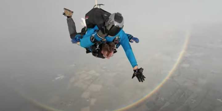See it: Skydivers capture true shape of a rainbow as they plummet toward Earth