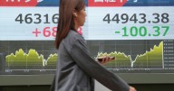 Asian shares are mixed as traders brace for a possible US government shutdown