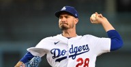 Andrew Heaney drinks from the Dodgers cup, strikes out eight in three inning stint