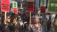Thousands rally in Toronto to 'draw the line' against PM Carney agenda