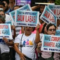 Philippines president says corruption scandal protests justified