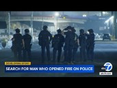 Man with rifle opens fire on LAPD officers