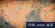 Soldiers build giant wall of dirt around city to trap 