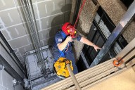 Man rescued via rope after being trapped in elevator for almost 7 hours