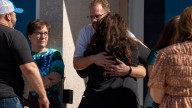 Families, community cling to each other after Michigan church shooting