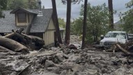 Mudslides trap drivers, bury roads and damage homes in southern California