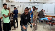 Palestinian man searches for child as Al Jazeera reports from Gaza hospital