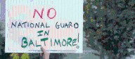 Dozens rally at City Hall to protest possible deployment of federal troops into Baltimore