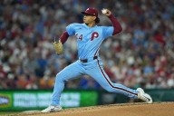 Luzardo retires 22 straight after rough start as Phillies sweep Mets and eye NL East title