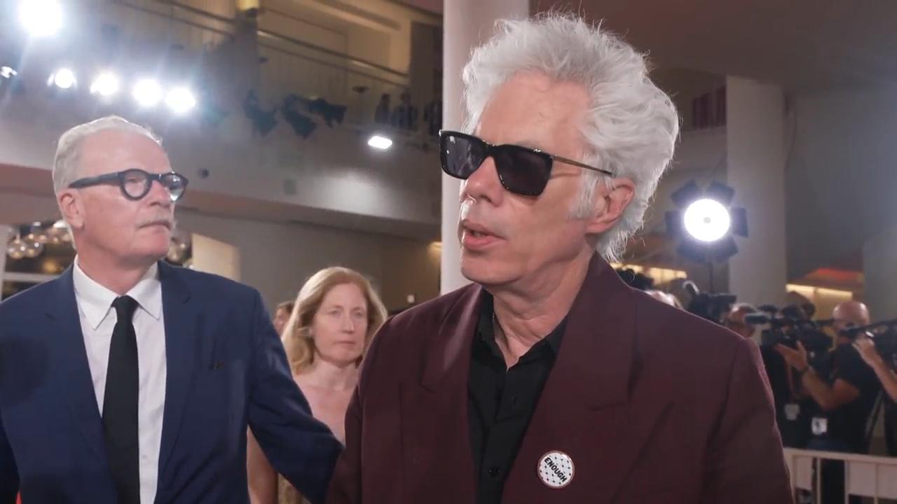 Director Jim Jarmusch wears pin calling for end to war in Gaza