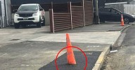 Confusion after New Zealand council asphalts a road cone into the footpath