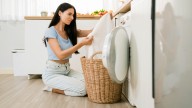 The Towel Mistake That's Making Your Load Of Laundry Smell Foul
