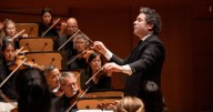Review: After 17 years, Dudamel's L.A. Phil farewell concert bridges two orchestras with 'Earth Between Oceans'