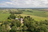 One of Yorkshire's great houses, burnt to the ground three generations ago, is back on its feet and on the market for the sixth time in a millennium