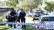 Police shoot man during a dramatic standoff at a burning home in Wynnum West, leaving him with life