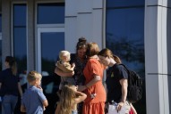 Families wait to reunite following Michigan church shooting