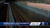 Two people swept away in Albuquerque arroyo get out safely