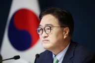 North Korea’s Kim shook hands with South Korea’s parliament speaker, Yonhap says