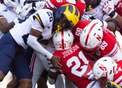 Idle Michigan falls in AP Top 25, college football rankings