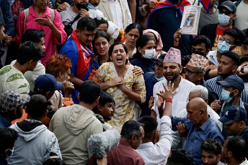 Weeping Nepalis hold funerals for those killed in deadly anti
