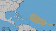 Hurricane center in Florida tracking disturbance and 3 tropical waves