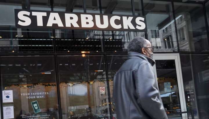 Starbucks to close hundreds of stores, lay off 900 workers as part of turnaround plan